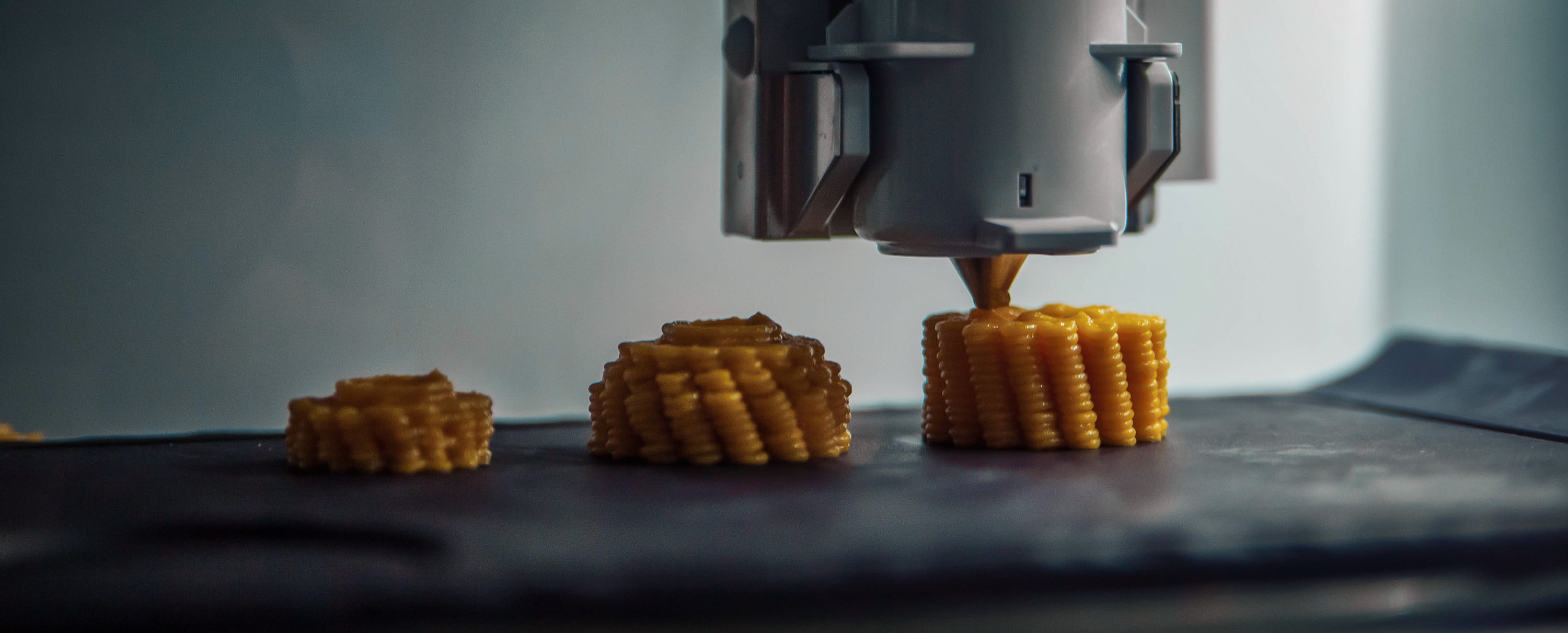 Living well in the 21st century. Limassol, Cyprus. 3d printer with a machine creating a corn shaped food. 