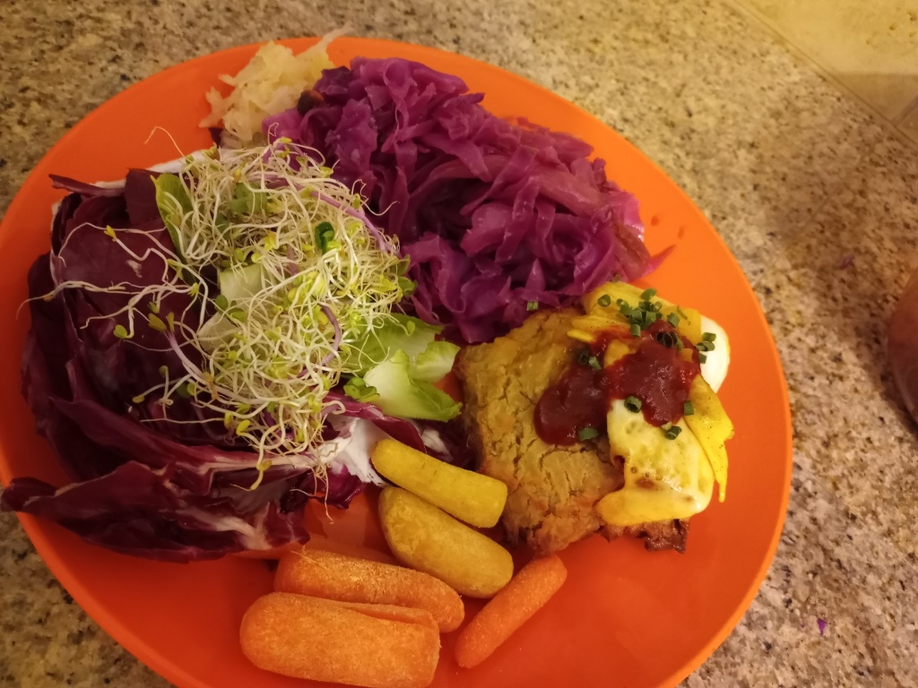 Living well in the 21st century - Limassol, Cyprus - gluten free sourdough biscuits with fried egg, cabbage with cumin & pear, and radicchio with spicy sprouts on the side. 