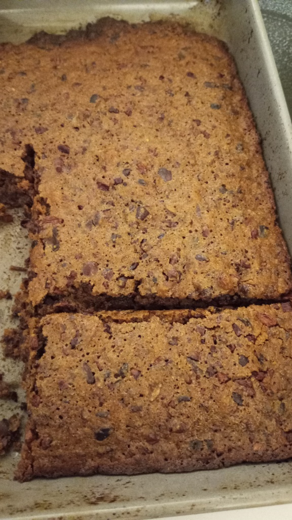 Living well in the 21st century - Limassol, Cyprus - Baking pan with a brown baked brownie with dark black cacao nibs. 